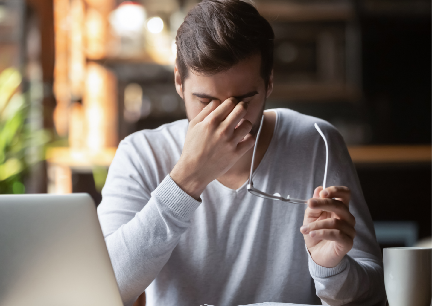 A guy touching his temporal due to stress